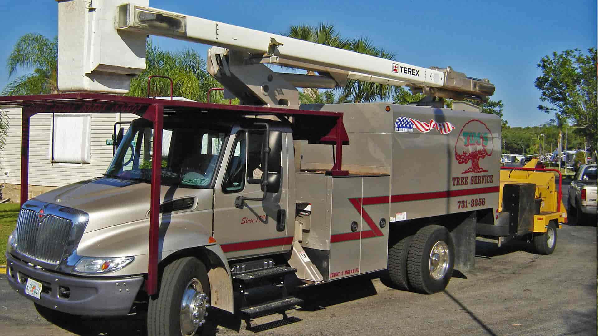 Tree services boom truck in Lee County, FL.