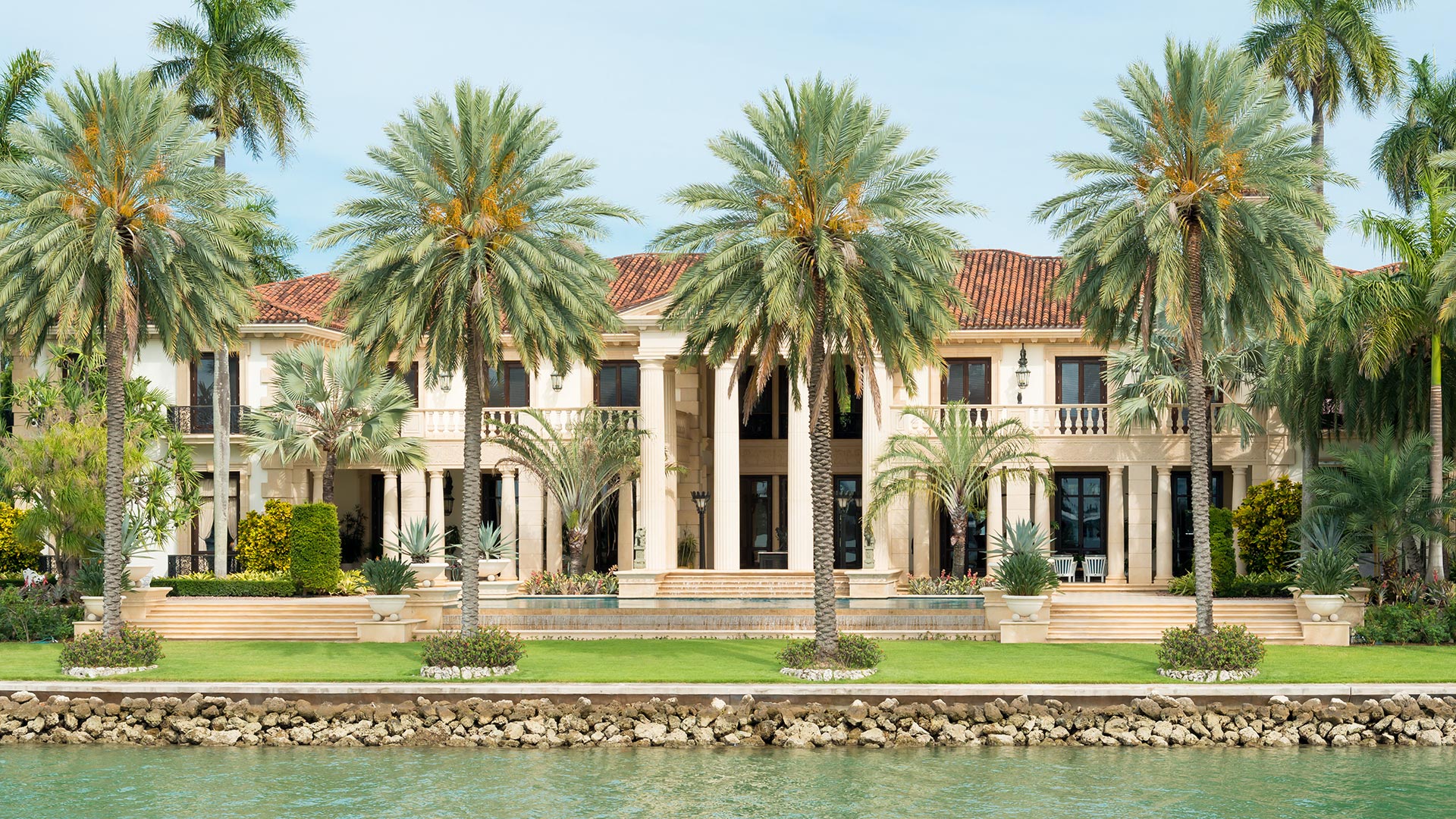 A home in McGregor, FL surrounded by large palm trees.